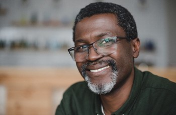 Man with beard and glasses smiling